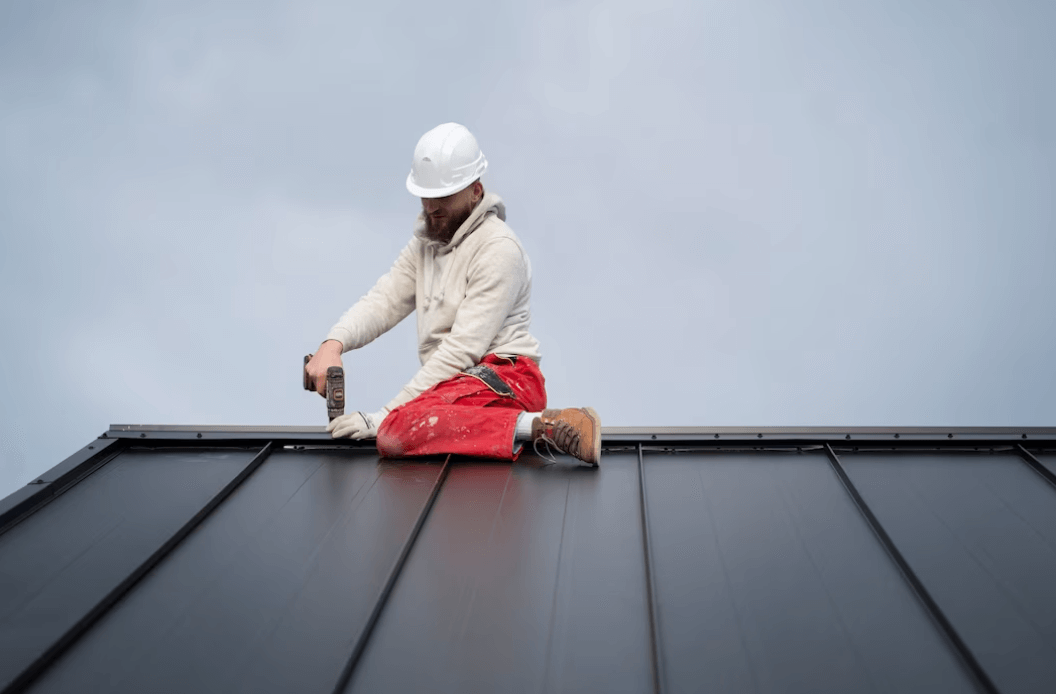 Roofers working on a roof during the off-season